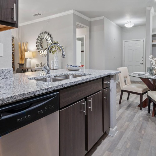 a kitchen with a marble counter top