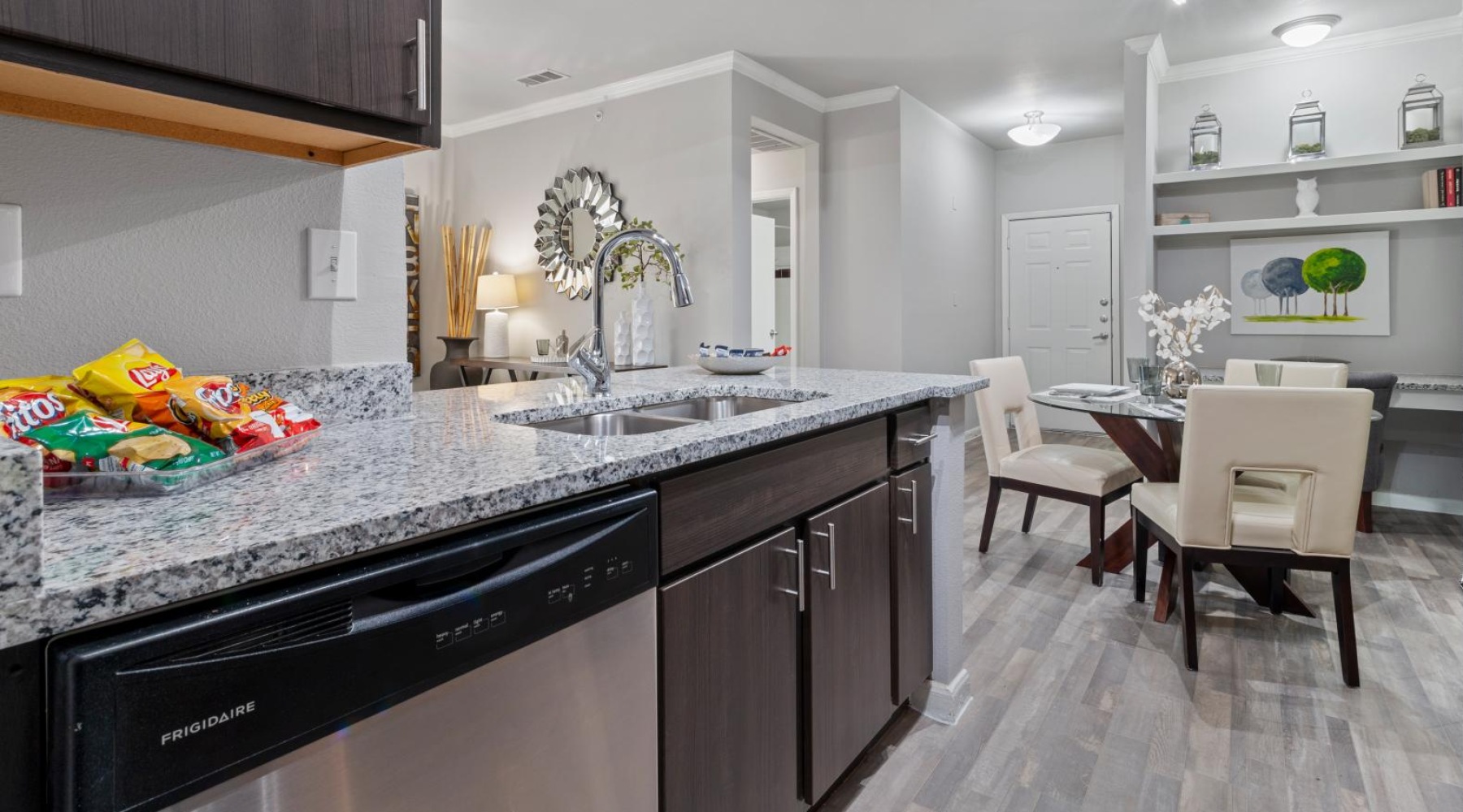 a kitchen with a marble counter top
