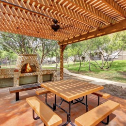 a picnic table and a fire pit