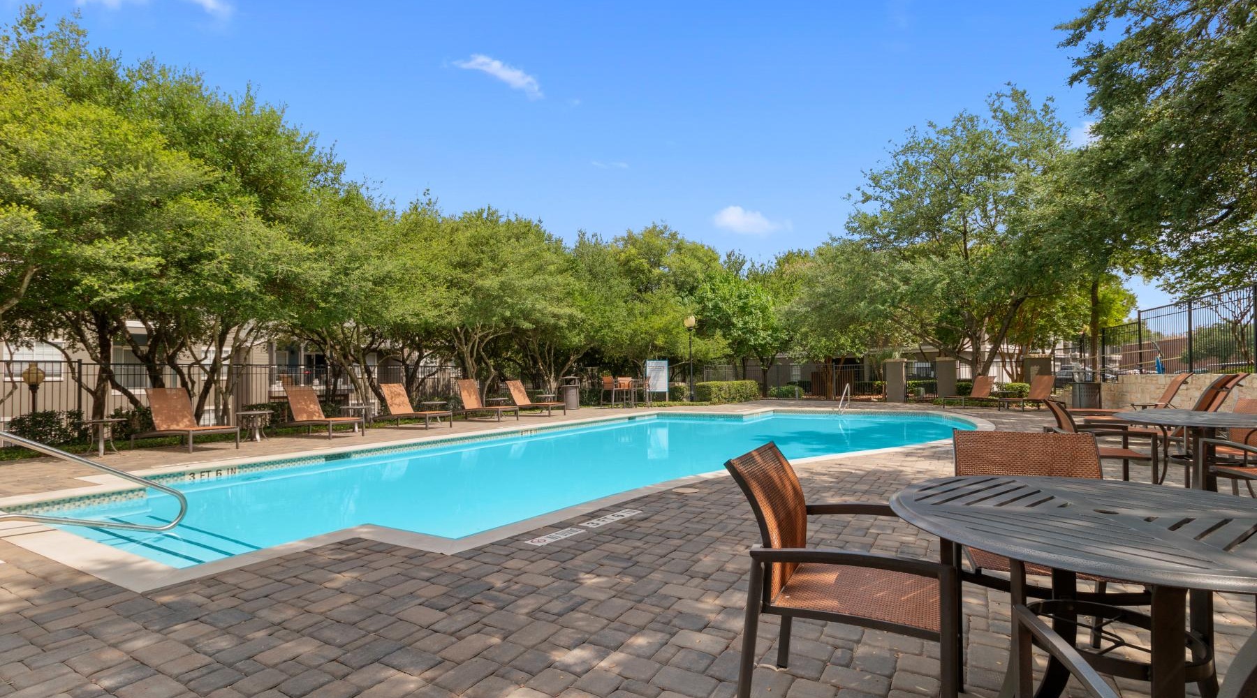 a pool with chairs around it