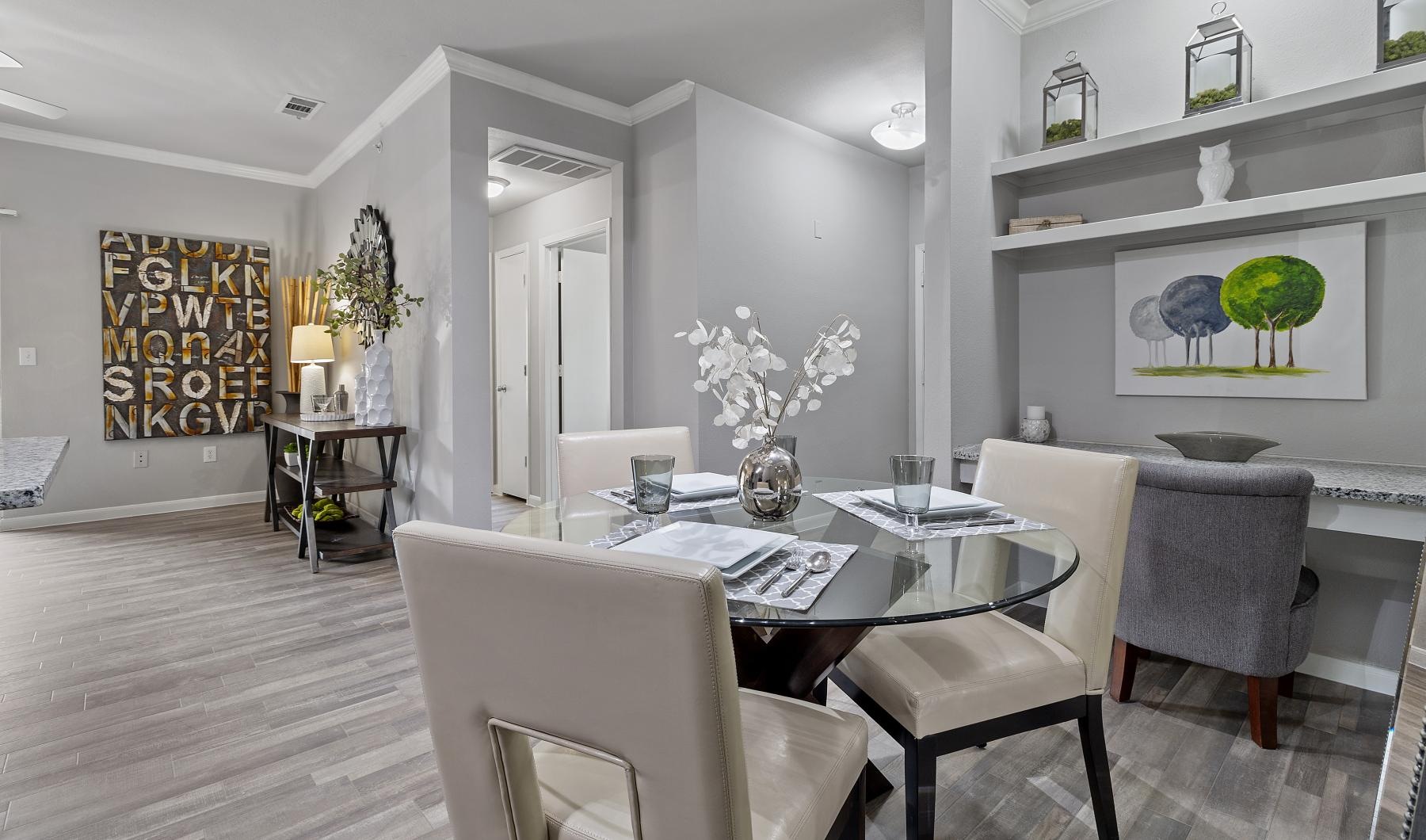 a dining room with a table and chairs