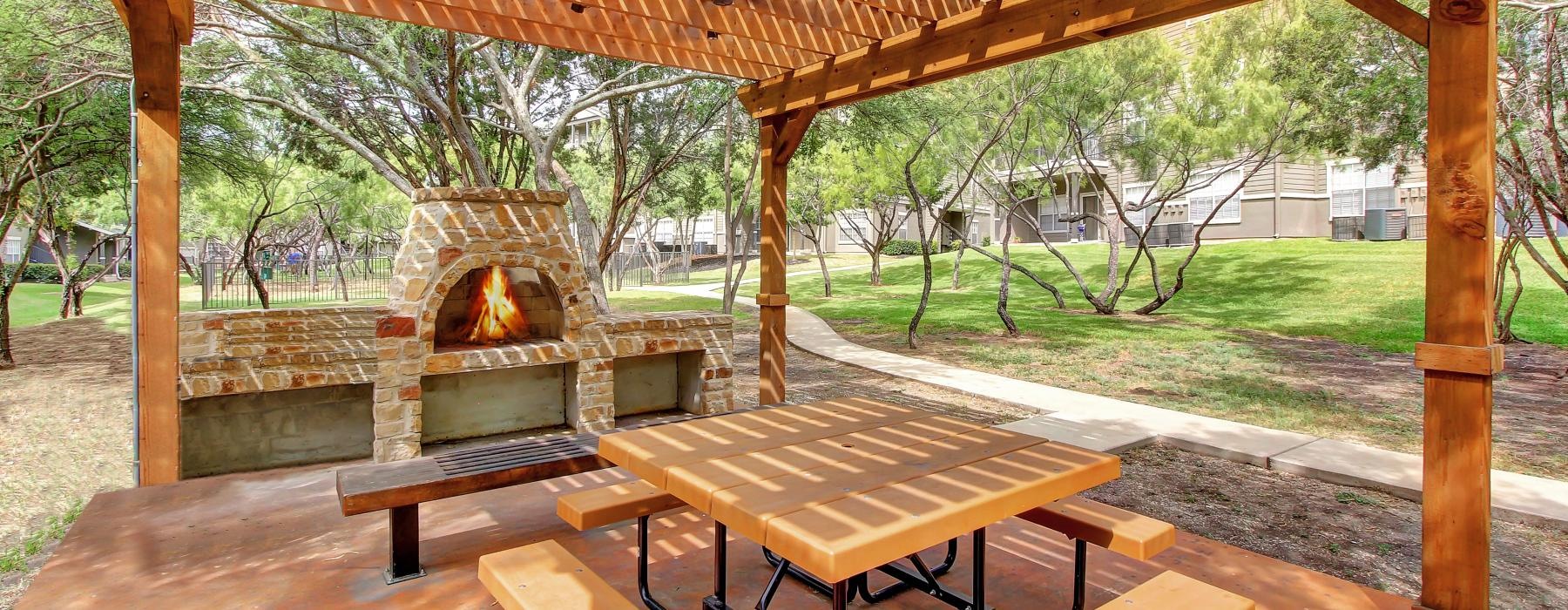 a picnic table and a fire pit